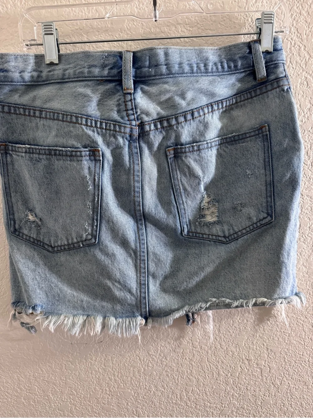Free People We the Free Distressed Denim mini skirt